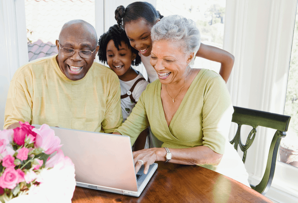 grandparents on the computer with their grandchildren