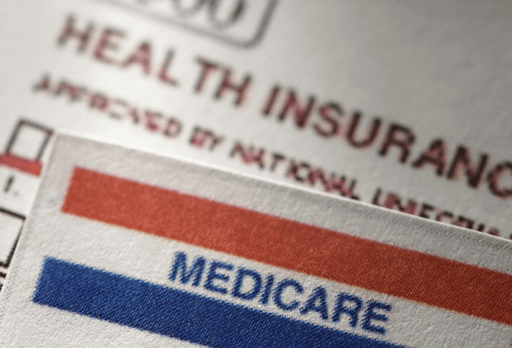 a picture of a medicare card and health insurance application
