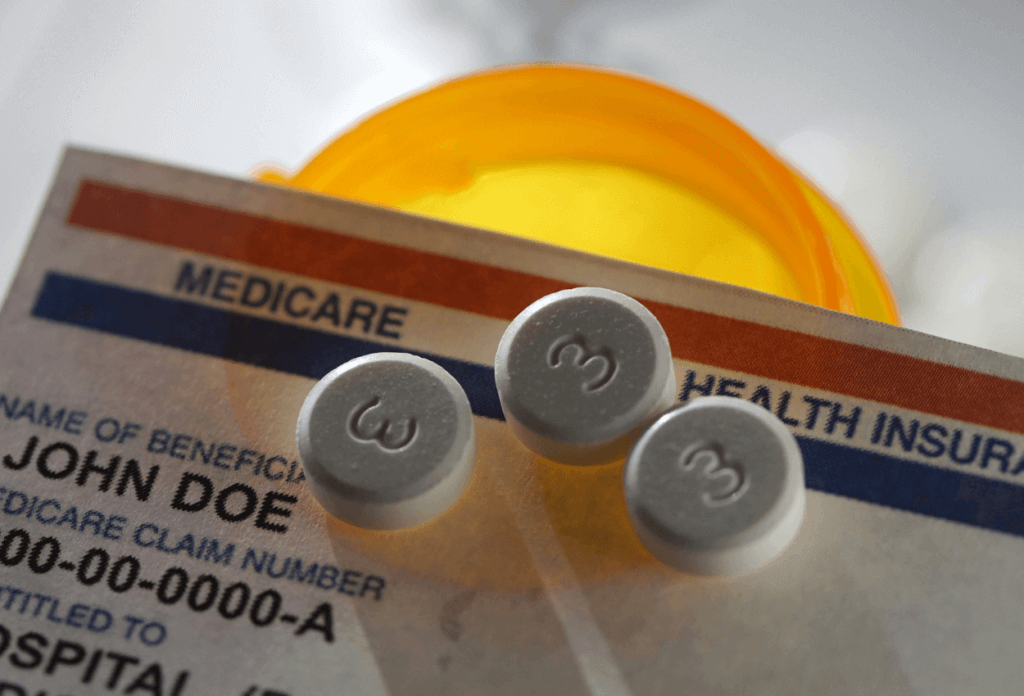 a picture of medicare health insurance card and prescription drugs