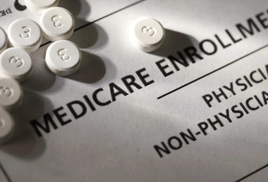 a picture of medication and a medicare enrollment form