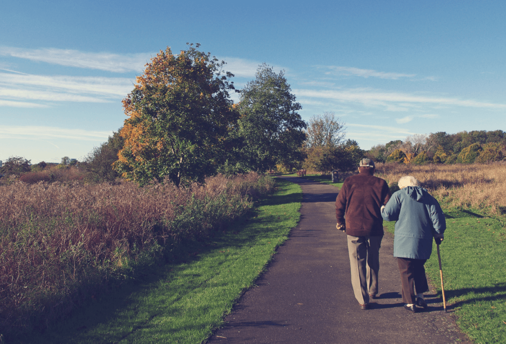 A picture of two seniors walking.