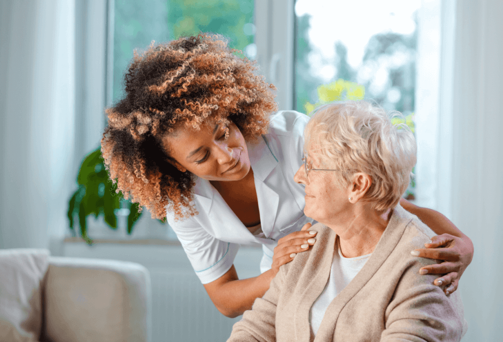 A nurse assisting a senior citizen at a nursing home