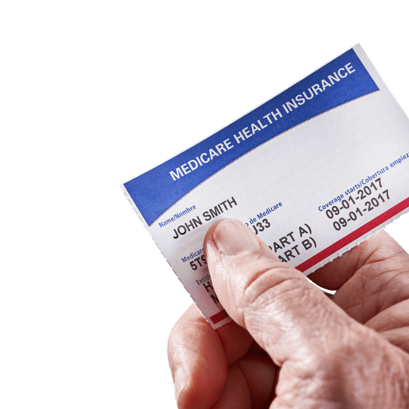 A picture of someone holding a Medicare health insurance card.
