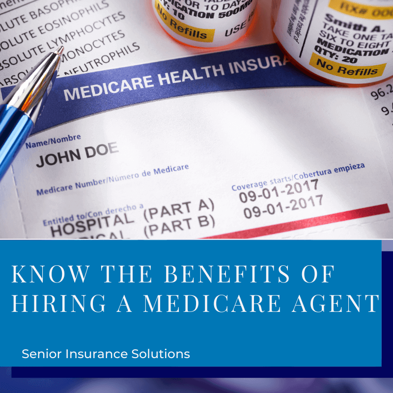 There's a pen and two pill bottles sitting on a Medicare card.