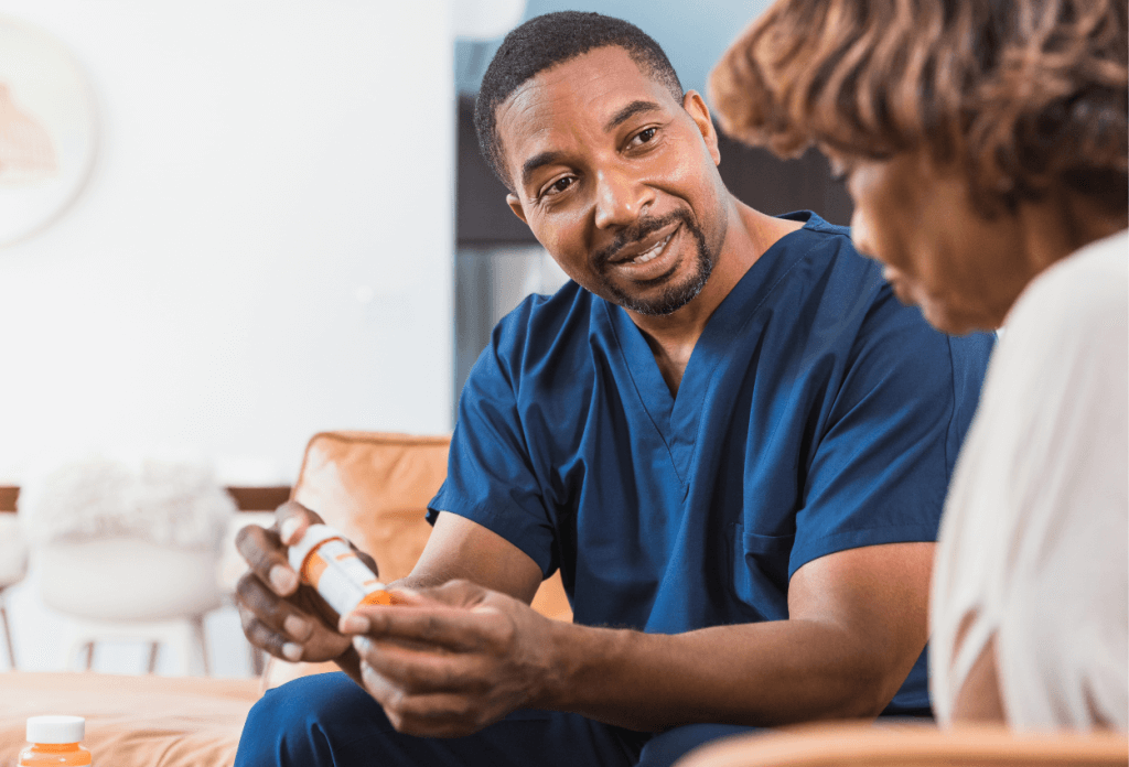 A male nurse is explaining medication to a female senior patient in a blog titled "Understanding Medicare for Chronic Illness: A Senior’s Path to Better Health."
