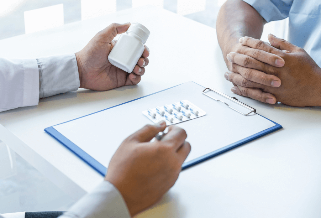 A pharmacist is showing prescription pills to a patient in an image for a blog titled "Medicare Open Enrollment 2024-2025: Your Guide to Making the Right Choice."